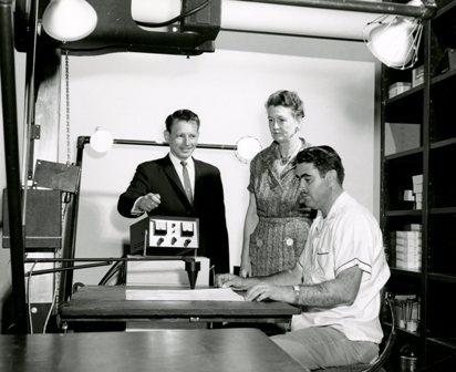 Archives staff with new microfilm unit circa 1961